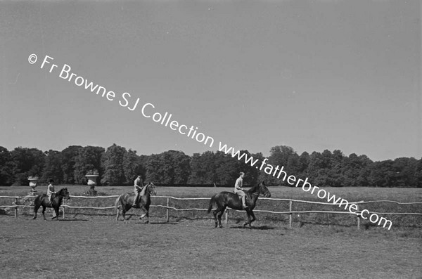 AT CASTLETOWN CHILDREN RIDING PATRICK JUMPING RIDING ON THE RING LADY CAREW & COL LEWIS JUDGING